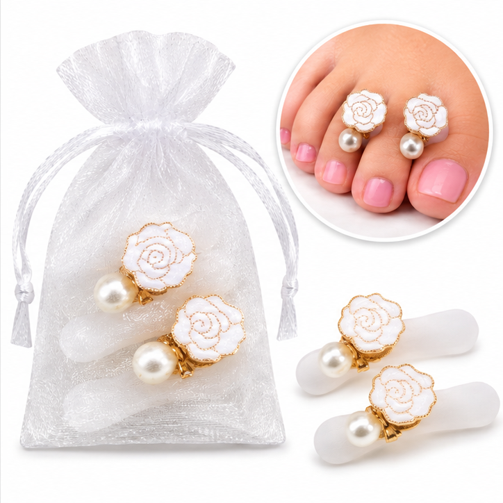 White rose and gold floral toe separators in organza bag with pedicure example